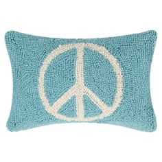 a blue pillow with a peace sign on it