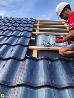 a man working on the roof of a building