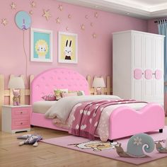 a child's bedroom decorated in pink and white