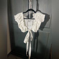 Nwt. White Cropped Blouse. Long String So You Can Either Tie It In The Front Or Around You. Super Cute!!! Size Xs/S White Ruffled Crop Top Blouse, White Fitted Crop Top For Daywear, White Crop Top Blouse For Daywear, White Crop Top Blouse For Beach, White Crop Top Blouse For The Beach, White Cropped Blouse For Vacation, Feminine White Crop Top Blouse, White Cropped Blouse For Brunch, White Crop Blouse