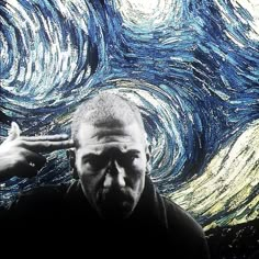 a man is pointing at the starry background with his hand in front of him