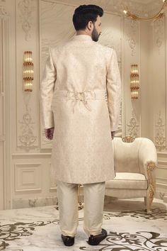 Make your big day even more special with our Mens Sherwani S20-S368! This groom's sherwani is adorned with stunning stones, adding a touch of luxury to your wedding ensemble. It will make you shine on your big day. Luxury Suits With Resham Embroidery For Weddings, Luxury Wedding Suits With Resham Embroidery, Elegant Traditional Wear With Intricate Embroidery For Groom, Designer Sherwani For Groom Traditional Drape, Designer Sherwani For Groom, Elegant Cream Sherwani With Dabka Work, Groom's Cream Kurta With Naqshi, Cream Kurta With Naqshi For Groom's Wedding, Designer Naqshi Traditional Wear For Weddings