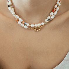 This Millefiori Pearl Necklace is a timeless piece suitable for any season to add a pop of color and fun to your outfit. Each necklace is beaded in a unique pattern, which means each necklace is different from the others, this delicate design makes it perfect for an effortless look. DETAILS:Water Resistant - Allergy-free18k Goldplated Stainless Steel Clasps, Ivory Freshwater Pearls, Millefiori Glass BeadsGold-filled seed beadsONE SIZE 16.5 inches NOTE: All designs are unique, photos are for refe Cheap Colorful Beaded Pearl Necklace, Elegant Multicolor Necklace With Tiny Beads, Bohemian Beaded Chain Necklace For Spring, Bohemian Beaded Necklace For Spring, Spring Beaded Chain Jewelry Gift, Colorful Beaded Necklaces For Spring, Colorful Round Beaded Necklaces For Spring, Spring Gift Beaded Necklaces With Tiny Beads, Spring Gift Beaded Necklace With Tiny Beads