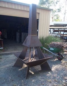 a large metal tower sitting in the middle of a yard