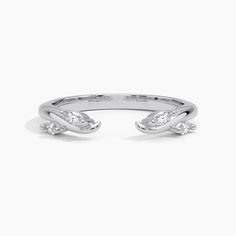 a white gold ring with three diamonds