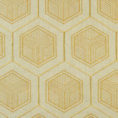 an upholstered wallpaper pattern with hexagons in yellow and white