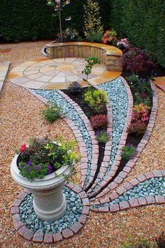 an outdoor garden with gravel and stones