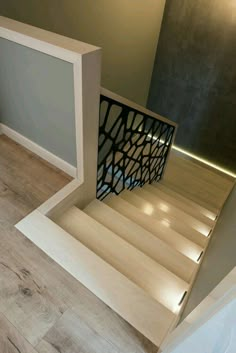 the stairs are made from plywood and have laser cut designs on them to match the wood flooring