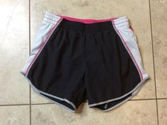 THIS IS A GREAT PAIR OF BLACK WHITE PINK & GRAY FIT DRY ATHLETIC RUNNING SHORTS FROM NIKE IN A WOMENS SIZE XS  (0-2) IN VERY GOOD CONDITION.  THESE SHORTS HAVE AN ELASTIC WAIST WITH DRAWSTRING, 100% POLYESTER, 3 3/4  INCH INSEAM, WAIST WILL STRETCH FROM 24 TO 32 INCHES, PANTY LINED.  AWESOME SHORTS!!!  WINNING BIDDER TO PAY WITHIN 4 DAYS AND ADD $4 FOR U.S. SHIPPING. NO INTERNATIONAL BIDDERS. NO REFUNDS. ALL SALES FINAL SO CHECK MEASUREMENTS. CHECK OUT MY OTHER AUCTIONS TO SAVE ON COMBINED SHIPP Nike Sporty Athletic Shorts For Training, Nike Stretch Athletic Shorts For Jogging, Nike Go-dry Athletic Shorts For Jogging, Nike Sporty Athletic Fit Shorts, Nike Sporty Workout Shorts, Nike Sporty Training Shorts, Nike Athletic Shorts For Jogging With Moisture-wicking, Nike Athletic Fit Shorts For Jogging, Nike Moisture-wicking Athletic Shorts For Jogging