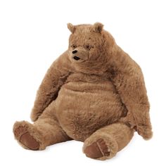 a large brown teddy bear sitting up against a white background