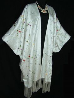 "ROMANTIC WHITE EMBROIDERED SILK KIMONO CAFTAN DUSTER OPERA COAT. MADE OF THE FINEST SILK SATIN WITH DELICATE FLORAL EMBROIDERY ALL OVER , FRINGES ON THE BOTTOM & FULLY LINED . Typical kimono cut and free size. XL UP TO 5X OPEN ON THE FRONT, the overall length is 46 1/2\" including the 7 1/2\" fringe with 8\" SIDE VENTS , UP TO 58\" BUST AND HIP. IT LOOKS GREAT AND VERY ELEGANT ON ALL PLUS SIZES UP TO 5X! THE SLIP DRESS IS NOT INCLUDED WE DO HAVE THIS CAFTAN IN 4 COLORS RED, BLACK WHITE &amp Opera Coat, Embroidered Kimono, Coat White, Witch Outfit, White Turquoise, Kimono Cardigan, Diy Keychain, Silk Kimono, Green Silk