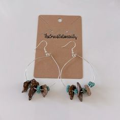 the small bird earrings are made from glass beads and silver hoops with turquoise accents