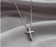 This elegant silver cross necklace combines timeless simplicity with modern flair. Made from premium 100% 316L stainless steel, it offers both durability and hypoallergenic properties, ensuring it's safe and comfortable for all skin types. The sleek silver finish enhances its understated beauty, while the delicate CZ stone chain adds a touch of sparkle. Perfect for daily wear or special occasions, this versatile necklace makes a meaningful gift for weddings, anniversaries, or other memorable moments. Its minimalist cross pendant symbolizes faith and hope, making it an ideal accessory for you or a loved one. Specifications: Material: 100% 316L Stainless Steel (surgical-grade, hypoallergenic, and tarnish-resistant) Color: Silver  Length: 40cm chain with a 5cm extension for adjustable wear Oc Cross Necklace For Men Silver, Simple Cross Necklace, Cross Necklace Simple, Timeless Simplicity, Silver Cross Necklace, Simple Cross, Necklace Cross, Pendant Necklace Silver, Necklace Minimalist