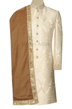 Elevate your wedding look with this exquisite ivory groom sherwani. Crafted with the finest self-design ivory fabric, this sherwani is lightweight and comfortable, ensuring you move with grace throughout your special day. Off White Sherwani With Chikankari Embroidery For Reception, Traditional Cream Sherwani For Groom, Beige Sherwani For Traditional Ceremonies And Festive Occasions, Cream Kurta With Resham Embroidery For Groom, Traditional Cream Bandhgala For Groom, Festive Beige Sherwani For Traditional Ceremonies, Off White Sherwani With Traditional Drape For Ceremonies, Cream Kurta With Traditional Drape For Groom, Cream Traditional Wear With Resham Embroidery For Groom