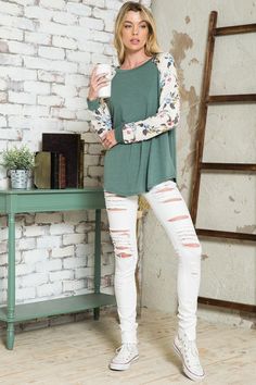 Pretty blooms pop on the raglan sleeves of a top that you'll want to pair with everything. Material: 87% polyester 10% rayon 3% spandex Stretch: Slightly stretchy Care: Machine wash cold, gentle cycle, do not bleach, tumble dry low. Made in USA Product Measurements S: 36.0-38.0” (Bust) M: 38.0-40.0” (Bust) L: 40.0-42.0” (Bust) Summer Stretch Raglan Sleeve Tops, Stretch Cotton Tops With Floral Print, Stretch Cotton Floral Print Tops, Casual Floral Print Tops For Loungewear, Spring Tops With Contrast Long Sleeves, Spring Cotton Tops With Contrast Sleeves, Spring Top With Long Contrast Sleeves, Spring Cotton Top With Raglan Sleeves, Floral Print Loungewear Tops For Fall