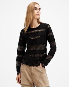 Get into lace this season. The Tiff Top features a mix of lace panels placed across the body with sheer elements on show. Shaped to an easy silhouette with a round neck and long sleeves - we think it's perfect for date night dressing. Pair with tailored pants or a denim skirt - it's simple styling with maximum impact.   This top is designed to a slim fit, we suggest sizing up for a looser fit. Button closure Round neck Long sleeve Textured mix of lace and sheer panels Keyhole button fastening at the back of the neck Lightweight Festival Essentials, Swimsuit Cover Up Dress, Night Tops, Black Sheer Top, Lace Trim Top, Trim Top, Going Out Outfits, Lace Panelled, Sheer Top