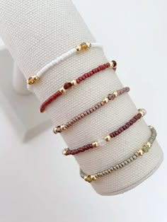 one seed bead stacking bracelet with 14k gold accent beads bracelets are made on a durable stretch elastic cord please refer to our sizing guide before purchasing Trendy Beaded Bracelets Diy, Seed Bead And Crystal Bracelets, String And Bead Bracelets, Simple Bracelets Diy Beads, Small Buissnes Bracelet, Dainty Beaded Jewelry, Stack Bracelets Beaded, Masculine Beaded Bracelets, Simple Seed Bead Bracelets