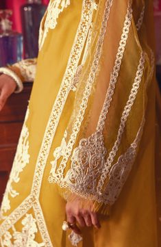 Lemon Yellow Embroidered Pakistani Salwar Kameez Dupatta Salwar Suit is an elegant masterpiece that will give you a stunning look. Hand-crafted embellishments and threads make this kameez and trouser style Dress an epitome of beauty and your foremost priority for the wedding. Embroidered Kameez: The beautiful kameez in premium chiffon is gracefully Hand embellished, with Tilla, Resham Zardozi, Naqshi, and floral designs. Hand-crafted details of motifs and sequins enhance the charm of this perfec Pakistani Boutique, Pakistani Salwar, Organza Sleeves, Readymade Saree, Pakistani Salwar Kameez, Chiffon Collection, Embroidered Sleeves, Embroidered Organza, Organza Dupatta