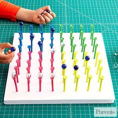 a person is playing with toothbrushes on a board that looks like it has been made out of plastic