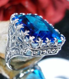 Excited to share the latest addition to my #etsy shop: 30ct Big Simulated Swiss Blue Topaz Art Deco/Victorian Prong Filigree Sterling Silver Ring Size {Made To Order} Design #215 https://etsy.me/30fhUTx #jewelry #ring #silver #no #yes #girls #blue #topaz #geometric Blue Topaz Ring Sterling Silver, Swiss Blue Topaz Ring, Edwardian Jewelry, Order Design, Swiss Blue Topaz, Filigree Ring, Blue Jewelry, Engraved Items, Silver Filigree