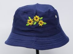 Item: flower embroidered bucket hat Material: polyester Size: one size fits most, brim measuring 2 inches long Embroidery: hand made with acrylic thread Free first class shipping, upgradable priority mail service. 30 days return policy, feel confident at your purchase! Summer Outdoor Bucket Hat With Embroidered Logo, Casual Cotton Sun Hat With Embroidery, Yellow Cotton Bucket Hat With Short Brim, Yellow Cotton Bucket Hat With Curved Brim, Embroidered Bucket Hat For The Beach, Blue Cotton Bucket Hat For Festivals, Yellow Cotton Summer Bucket Hat, Yellow Summer Cotton Bucket Hat, Handmade Yellow Cotton Hats