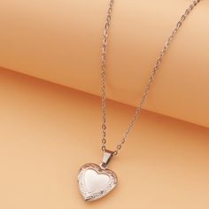 Adorn your neckline with a heart locket pendant necklace, elegantly crafted in gold-plated stainless steel for a timeless and sentimental accessory. Material: Stainless Steel 18k Gold plated Chain length: 40cm+ 5cm/ 16"+2" Pendant: 22mm / 0.9" Weight: 7g Timeframes may be extended during the lead up to the peak holiday season, so please get your orders in early. All individual items will be shipped separately within each order.We will contact you if we require any clarification or further details for your order. Order a Love Locket Necklac today and surprise your loved ones with a secret message they can cherish forever ❤ Elegant Heart Pendant Locket Necklace In Metal, Elegant Metal Heart Pendant Locket Necklace, Elegant Heart Pendant Locket Necklace, Elegant Metal Locket Necklace For Valentine's Day, Rose Gold Pendant Locket Necklace With Adjustable Chain, Elegant Locket Necklace For Valentine's Day, Rose Gold Metal Heart Necklace For Mother's Day, Elegant Valentine's Day Locket Necklace Gift For Her, Rose Gold Heart Pendant Necklace In Stainless Steel