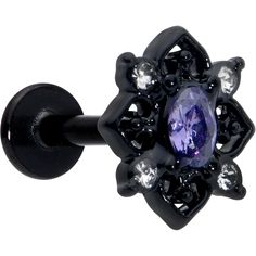 a black ring with an amethorate and crystal stones