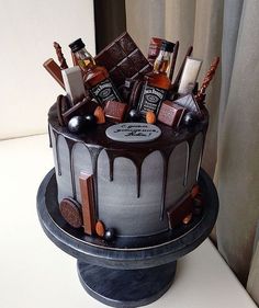 there is a chocolate cake with liquor on the top and other items in the middle