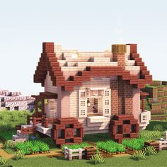 a house made out of bricks in the middle of a field