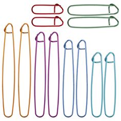 six different colored paper clips in various shapes and sizes