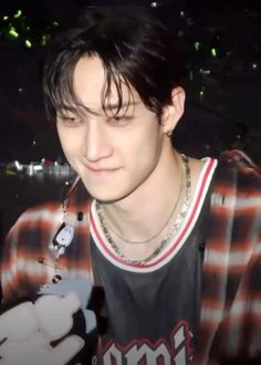 a young man with black hair and piercings