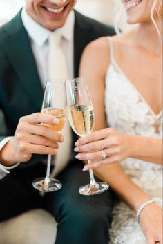 three people are toasting with wine glasses