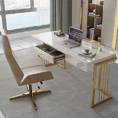 a desk with a laptop on it next to a chair