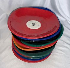 a stack of colorful plates sitting on top of each other