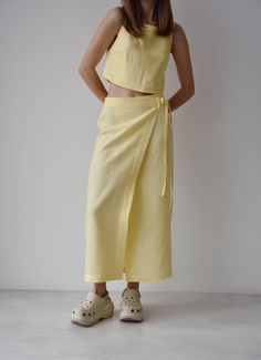 Linen wrap skirt with slit, Yellow linen skirt, Maxi wrap skirt for women, Long wrap skirt, Boho skirt Linen wrap skirt with slit.  Maxi wrap skirts with, perfect for warmer seasons day and night. Wear our wrap skirts with a cami top, trainers, flats or heels. Perfect for a dinner date, party, wedding and as an evening wear. Maxi wrap skirts can comfortably be adjusted at the waist to define and flatter. ■ color: yellow ■ material: 100% linen ■ style: - wrap skirt - relaxed fit - mid-calf length - high waist - textile belt - raw edge ■ to get the full look, check our crop top here: https://www.etsy.com/shop/stlKatinStore?ref=shop-header-name&listing_id=1235678787&from_page=listing§ion_id=38130077 ■ the color might be slightly different from the picture due to the light and screen. Please c Wrap Skirt Outfit, Linen Wrap Skirt, Maxi Wrap Skirt, Smart Dolls, Long Wrap Skirt, Linen Fashion, Boho Skirt, Wrap Maxi Skirt, Skirt Maxi