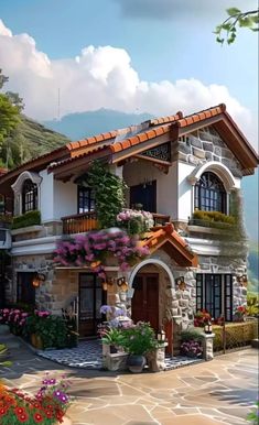 a house with lots of flowers on the front and side of it, surrounded by greenery