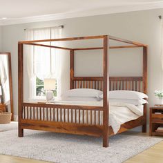 a bedroom with a four poster bed and white linens on the floor, in front of a window