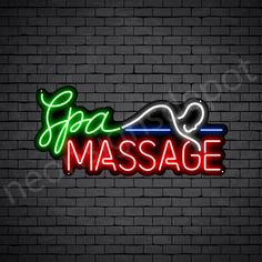 the neon sign for spa massage is shown on a brick wall with a black background