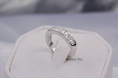 a white gold ring with three diamonds on it