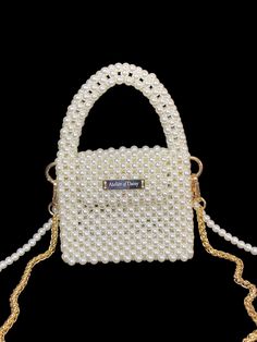 Explore our exquisite collection of handmade bags, featuring unique designs perfect for any occasion. Elevate your style with our elegant Women's Bag, ideal for weddings and special events. Our White Pearl Handbag is a luxurious accessory that adds a touch of sophistication to your ensemble. Whether you're a bride looking for the perfect bag or searching for a Valentine's Day gift, our range of trendy and carefully crafted bags ensures you stand out at any evening party. Embrace the allure of ou Luxury Portable Bags For Gifts, Luxury Portable Bags Perfect For Gifts, Luxury Portable Bag As A Gift, Luxury Pouch Shoulder Bag For Gift, Luxury Pouch Shoulder Bag As Gift, Trendy Handheld Evening Bag As Gift, Trendy Square Evening Bag For Gift, Chic Handheld Shoulder Bag As Gift, Trendy Square Evening Bag As Gift