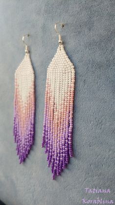 These handmade earrings are made of high-quality Czech beads and strong synthetic thread. They are elegant, fashionable, and highly versatile, suitable for everyday wear. Color: white,pink and purple . 100% hand made with love! Measurements: Length-12cm,Width -2.6 cm Materials: Silver plated ear hooks Czech glass beads Tytan Thread White Colorful Beads Drop Tassel Earrings, White Colorful Beads Tassel Drop Earrings, White Tassel Drop Earrings With Colorful Beads, Elegant White Chandelier Earrings With Colorful Beads, Handmade White Tassel Drop Earrings, Colorful Beaded White Chandelier Earrings, White Handmade Tassel Drop Earrings, White Round Beads Tassel Earrings Gift, Handmade Pink Dangle Tassel Earrings