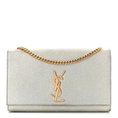 This is an authentic SAINT LAURENT Metallic Calfskin Medium Classic Monogram Kate Satchel in Pale Gold. This shoulder bag is crafted of distressed metallic calfskin leather in light gold. This crossbody features a polished gold chain link shoulder strap and YSL logo. The front flap opens to a black fabric interior with a small patch pocket. Ysl Kate Monogram Bag, Quilted Toys, Kate Bags, Classic Monogram, Ysl Logo, Pale Gold, Saint Laurent Bag, Black Cross Body Bag, Black Fabric