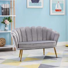 a living room scene with focus on the sofa and chair in the foreground, there are bookshelves