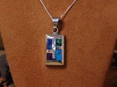 "Beautiful sterling silver multi-color inlay pendant slide with a 18\" box chain. The inlay pendant has synthetic malachite azurite, sugilite, turquoise and malachite. The pendant measures 1 11/16\" tall, including the bail, and 11/16\" wide. The pendant is stamped \"925\". Great versatile piece! Please feel free to ask any questions you may have, and thanks for taking a look! MS-4 ^" Rectangular Sterling Silver Jewelry With Inlay, Rectangular Multicolor Sterling Silver Jewelry, Rectangular Inlay Jewelry For Gifts, Arrowhead Necklace, Turquoise Bracelet Cuff, Turquoise Cuff, Tucson Az, Wire Earrings, Multi Stone