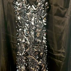 Never Worn Cocktail Dress. Size 8 With Tag Still Attached. 100% Silk. Black And Silver Sequins. Low Cut. Spaghetti Straps. Above The Knee. Great Nye Party Dress! Silver Sequin Cocktail Dress With Contrast Details, Silver Sequin Dress With Contrast For Cocktail, Silver Sequin Dress With Contrast Details For Cocktail, Silver Sequin Dress For Cocktail Occasions, Silver Formal Dress With Contrast Sequin, Silver Embellished Sequin Evening Dress, Silver Contrast Sequin Formal Dress, Formal Silver Dresses With Contrast Sequin, Silver Sequin Evening Dress For Gala