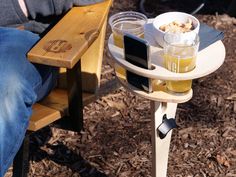 a wooden table topped with drinks and snacks