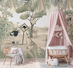 a baby's room decorated in pink and green with animals on the wall, along with a canopy bed