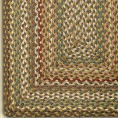 braided rugs in various colors and sizes