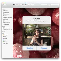 an image of a woman on her cell phone in front of some red grapes with the caption airdrop