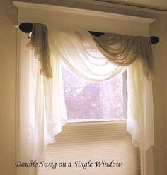 an open window with white curtains and the words, double swag on a single window